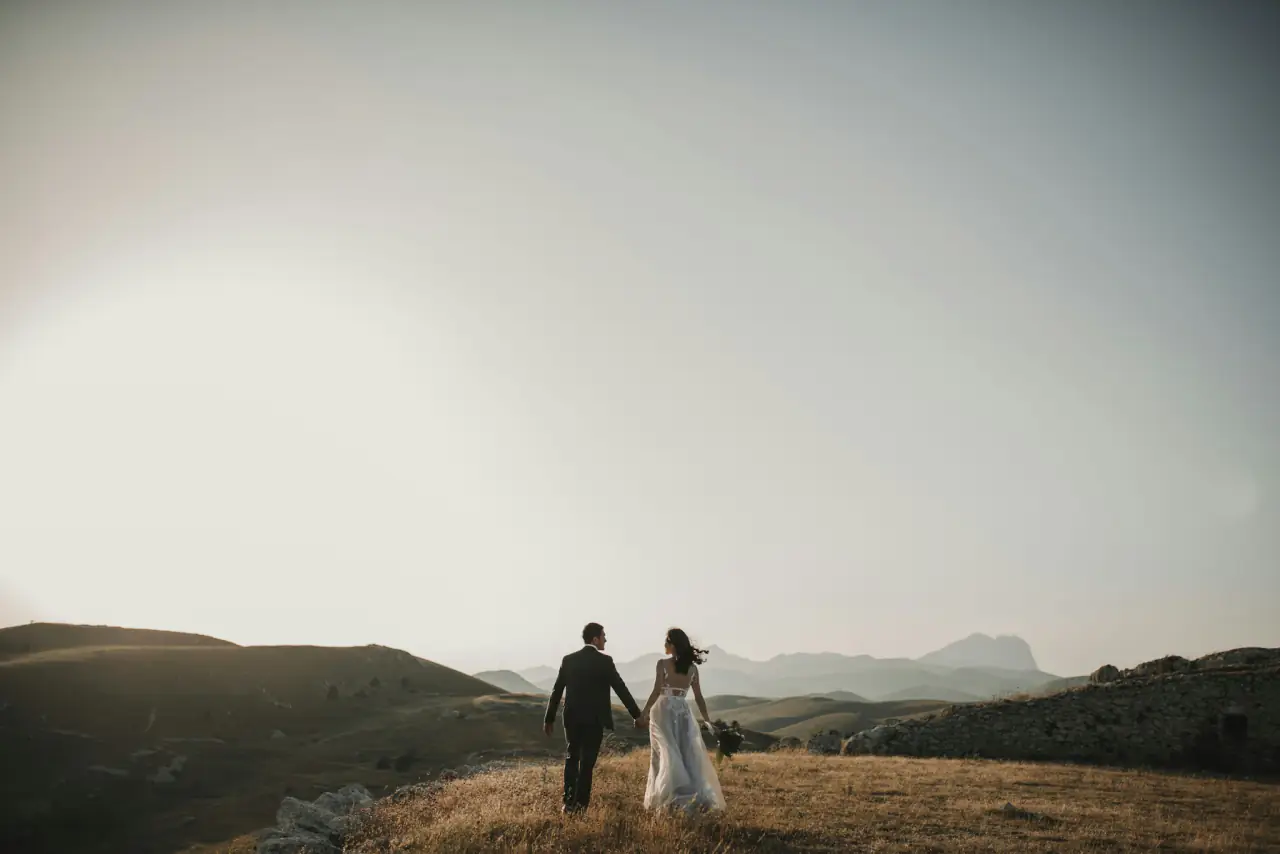 Couple on a hilltop at dusk